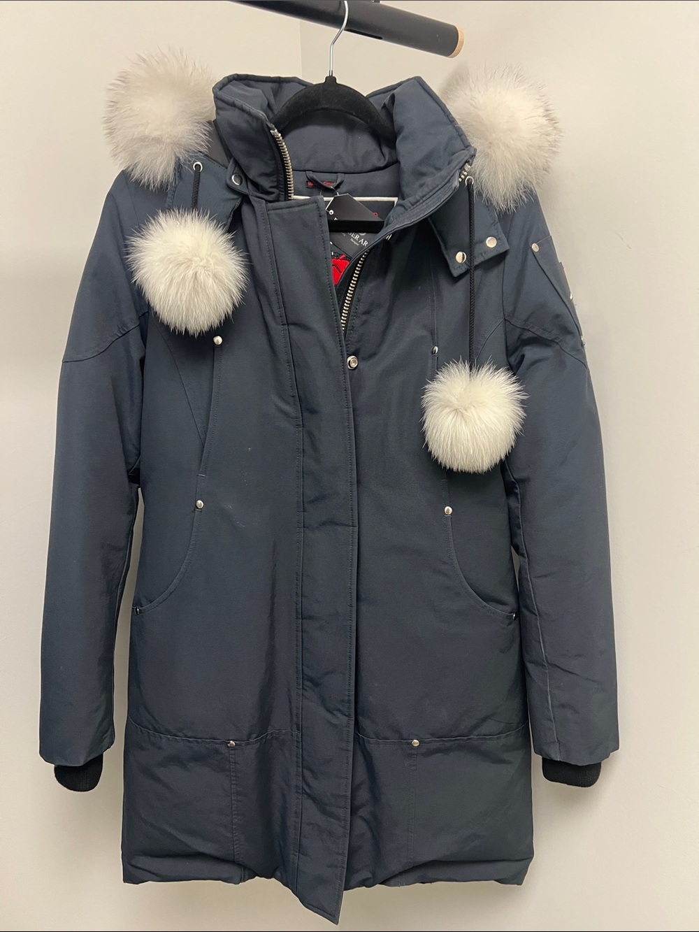 Moose Knuckles Navy Parka with White Faux Fur Pom-Poms